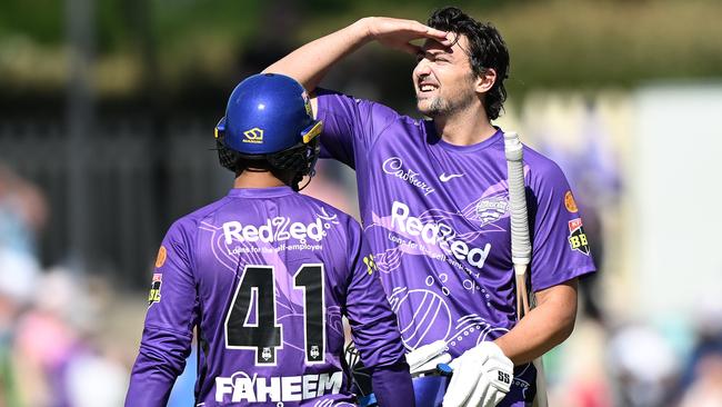 HOBART, AUSTRALIA - JANUARY 15: Tim David of the Hurricanes reacts after hitting a six to win the match during the Men's Big Bash League match between the Hobart Hurricanes and the Sydney Thunder at Blundstone Arena, on January 15, 2023, in Hobart, Australia. (Photo by Steve Bell/Getty Images)