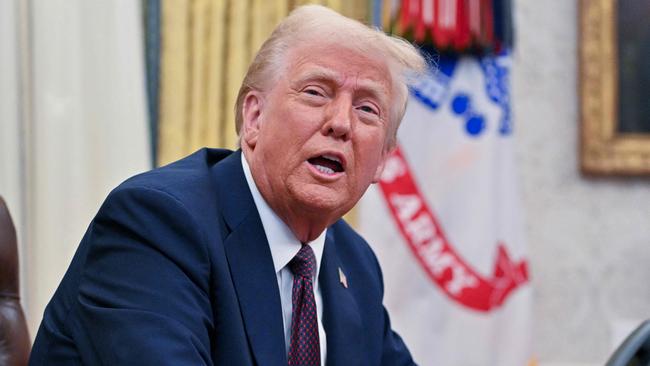 US President Donald Trump speaks to the media after signing executive orders in the Oval Office of the White House in Washington, DC, on January 23, 2025. (Photo by ROBERTO SCHMIDT / AFP)