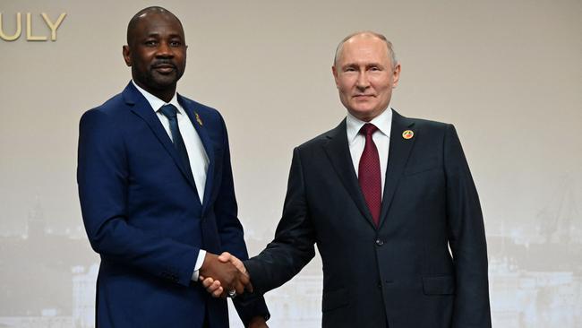 This pool image distributed by Sputnik agency shows Russian President Vladimir Putin greeting the leader of Mali's junta, Assimi Goita on July 27, 2023. Picture: Pavel BEDNYAKOV / POOL / AFP