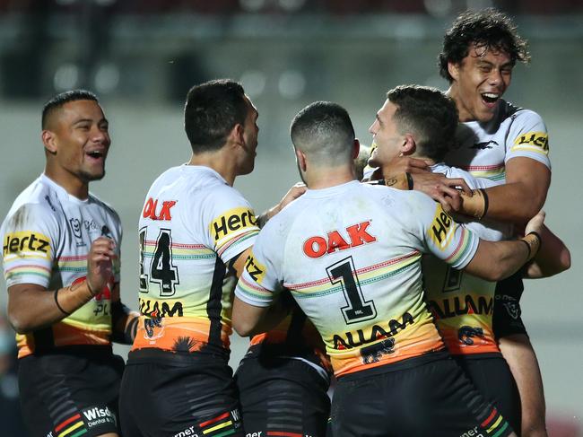 SYDNEY, AUSTRALIA - AUGUST 01: Nathan Cleary of the Panthers is congratulated by team mates after scoring a try during the round 12 NRL match between the Manly Sea Eagles and the Penrith Panthers at Lottoland on August 01, 2020 in Sydney, Australia. (Photo by Jason McCawley/Getty Images)