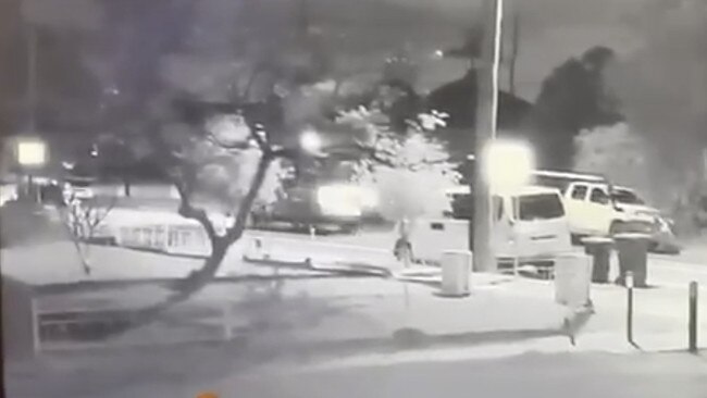 Footage appears to show a person lean out of a car and fire a gun.