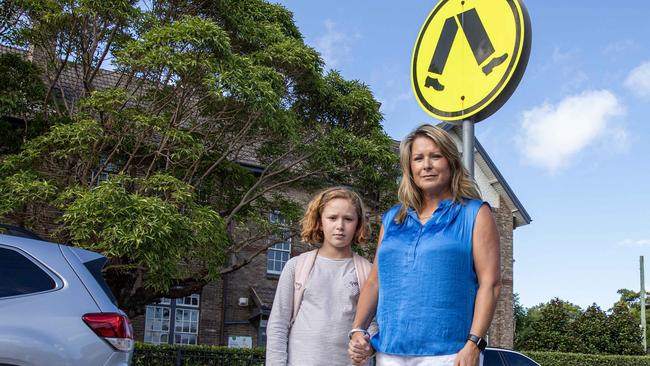 Jacqueline Dearle and her daughter out the front of Cammeray public school. Picture: Jeff Williamson.