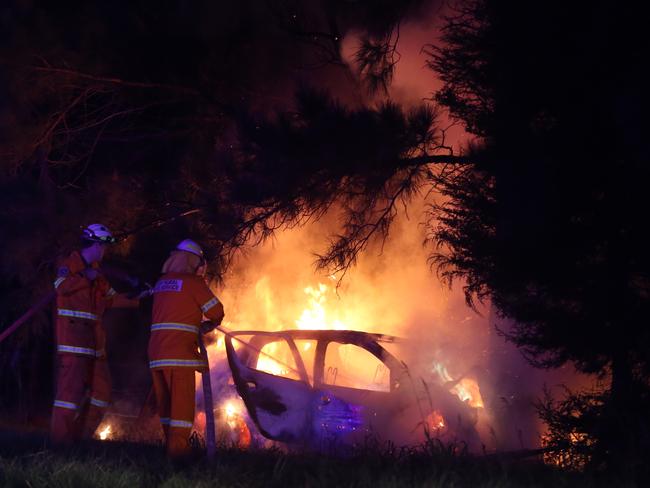 The small hatchback burst into flames following the accident just after 5.30am. Picture:John Grainger