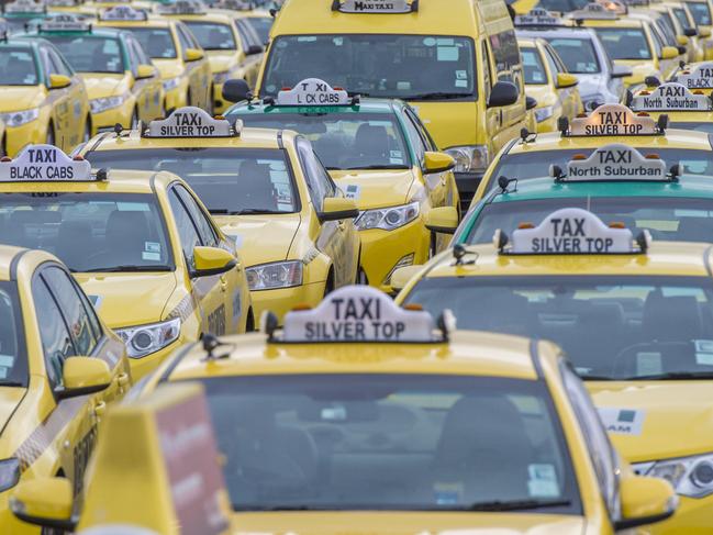 Taxis waiting up to 3 hours to make it all the way to the terminal to pick up a customer. The average fare is to the city making the driver only $20 for their cut of the fare. (paying insurance, driver training, safety cameras and gps for cars that Uber drivers do not). Picture: Jason Edwards