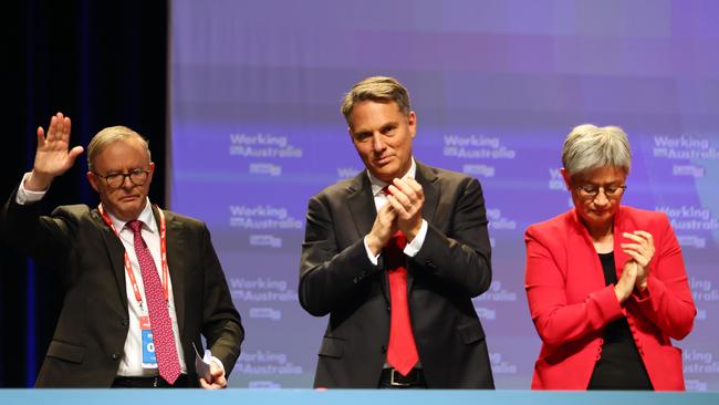 Prime Minister Anthony Albanese, left, Deputy Prime Minister Richard Marles and Minister for Foreign Affairs Penny Wong react after AUKUS was passed during the ALP National Conference in Brisbane. Picture: NCA NewsWire/Tertius Pickard