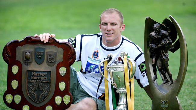 Pictured in 2006 then-Brisbane Broncos captain Darren Lockyer with the Tri-Nations, State of Origin and Premiership trophies.