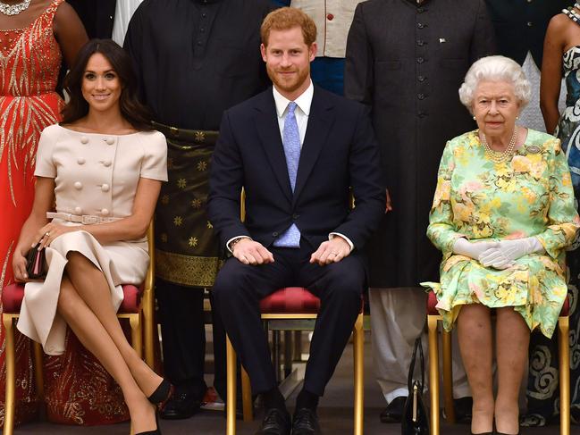 Once were royals … Meghan, Prince Harry and the Queen in 2018. Picture: AFP