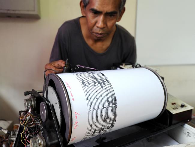 A man monitors seismic waves at the Mount Agung monitoring station in Karangasem on the Indonesian resort island of Bali. Picture: AFP