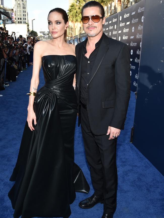 Angelina Jolie and Brad Pitt arrive at the world premiere of &lt;i&gt;Maleficent&lt;/i&gt; in LA.