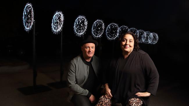 Illuminate Adelaide co-founders and artistic directors, Lee Cumberlidge and Rachael Azzopardi, with the Row installation by Russian collective TUNDRA. Picture: Matt Turner.