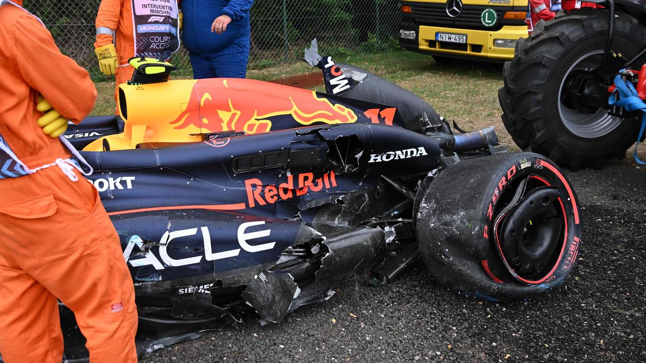 The damaged car of Red Bull Racing's Mexican driver Sergio Perez. Photo by Ferenc ISZA / AFP.