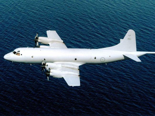 10/01/2003 PIRATE: RAAF antisubmarine Lockheed Martin P-3C Orion aircraft painted in new color scheme in flight. aeroplane plane /Aeroplanes