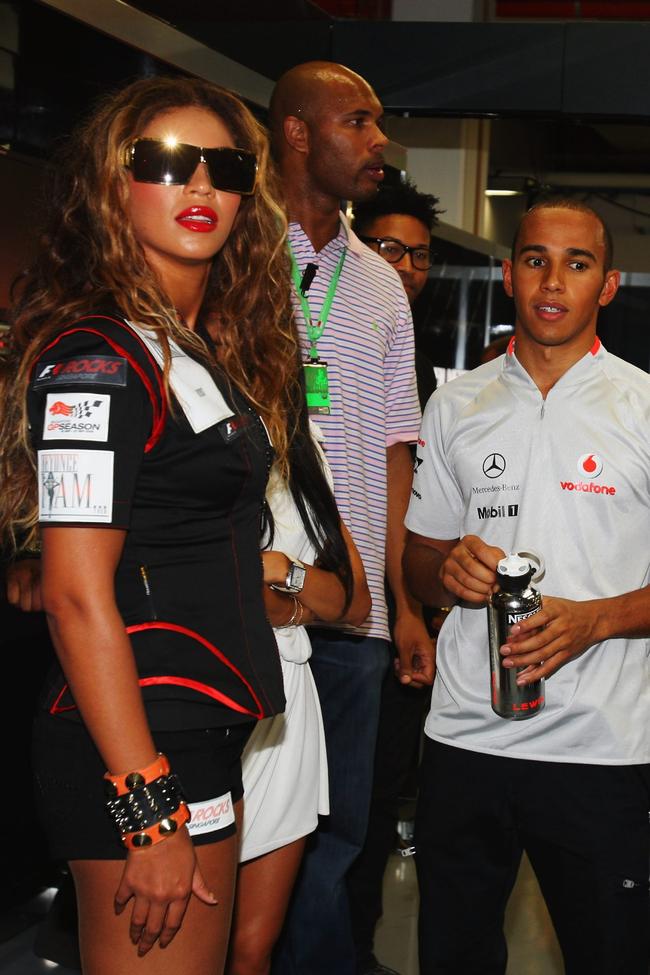 Beyoncé and F1 driver Lewis Hamilton at the Singapore Formula One Grand Prix, 2009. 
