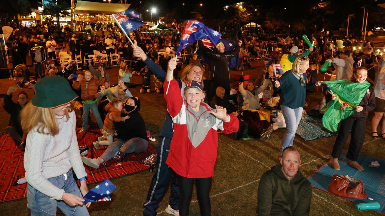 Audience members celebrate at Kings Beach in Caloundra as Brisbane is announced as the host of the 2032 Olympic Games. Picture: Lachie Millard