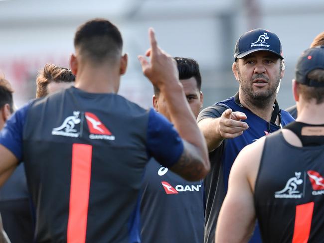 Wallabies coach Michael Cheika (centre) is seen during training at Ballymore in Brisbane, Tuesday, June 5, 2018. The Australian Wallabies are facing Ireland in the first test of a three game series on June 9 at Suncorp Stadium in Brisbane. (AAP Image/Darren England) NO ARCHIVING