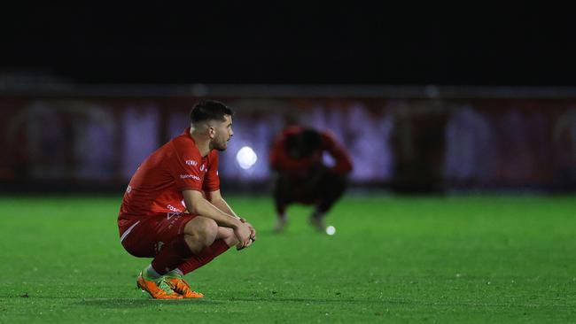 Dejected Hume City players after the final siren.