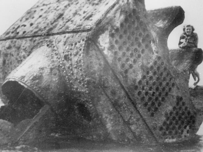 Mrs Hughes on a boiler of the Maitland shipwreck which was wrecked at Maitland Bay in 1898. Wreckage from the disaster remained on the rock platform for years.
