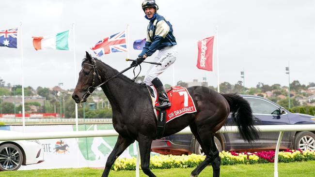 Glen Boss returns to the mounting yard aboard Sir Dragonet after winning the Cox Plate. Picture: Racing Photos/Getty Images.