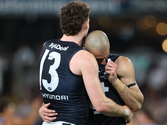 Blake Acres consoles Adam Saad after the Blues preliminary final loss to the Lions at the Gabba. Picture Lachie Millard