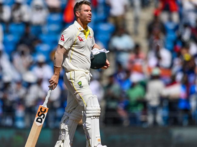 Australia's David Warner walks back to the pavilion after his dismissal during the third day of the first Test cricket match between India and Australia at the Vidarbha Cricket Association (VCA) Stadium in Nagpur on February 11, 2023. (Photo by Indranil MUKHERJEE / AFP) / IMAGE RESTRICTED TO EDITORIAL USE - STRICTLY NO COMMERCIAL USE