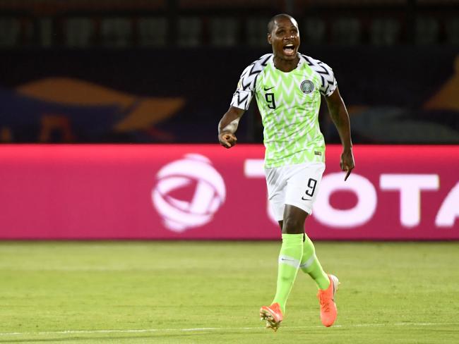 (FILES) In this file photo taken on July 17, 2019 Nigeria's forward Odion Ighalo celebrates after scoring a goal during the 2019 Africa Cup of Nations (CAN) third place play-off football match between Tunisia and Nigeria at the Al Salam stadium in Cairo on July 17, 2019. - Odion Ighalo Manchester United's January signing from China has been training away from the club's facilities as a precaution due to the outbreak of the new coronavirus outbreak British media reported on on February 13, 2020. (Photo by Khaled DESOUKI / AFP)