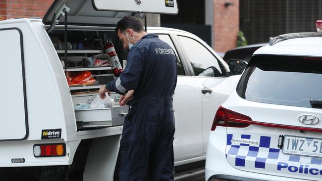 Forensics crews on the scene. Picture: David Crosling