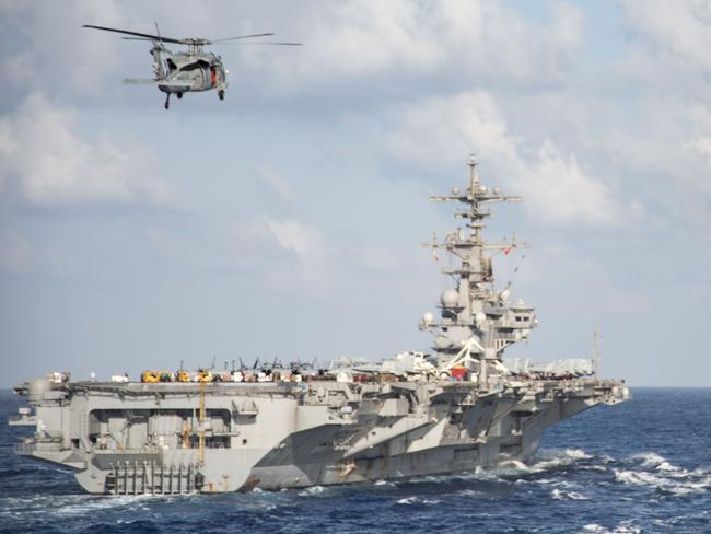 An anti-submarine MH-60S Sea Hawk helicopter from the aircraft carrier USS George H.W. Bush (CVN 77) during a replenishment-at-sea in the Mediterranean Sea on June 21. It is likely to have been involved in the hunt for Krasnodar. Picture: US NAVY