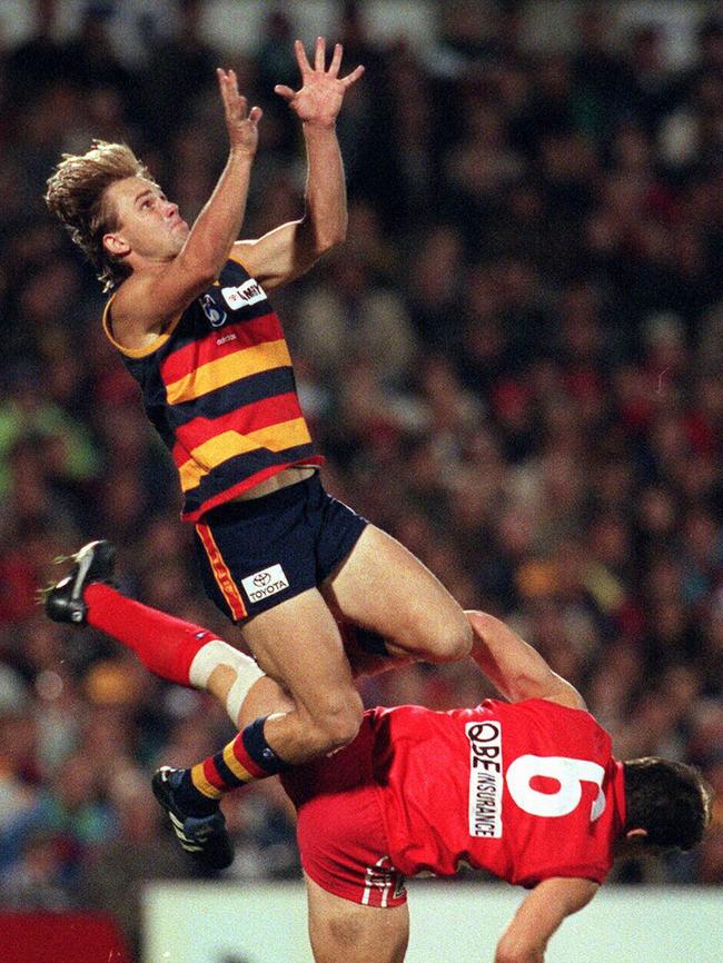 Adelaide’s Tony Modra taking mark over Sydney’s Andrew Dunkley.