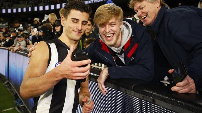 Nick Daicos of the Magpies celebrates with fans after winning the round 15 AFL match between the Collingwood and GWS. Picture: Daniel Pockett/Getty Images