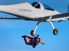 TOPSHOT - Initiator of sun-powered stratospheric SolarStratos plane project Raphael Domjan jumps during a successful world record attempt by jumping with a parachute from a solar-powered plane on August 25, 2020 in Payerne, western Switzerland. - The SolarStratos, a sleek, white, two-seater aircraft with long wings, covered with 22 square metres (237 square feet) of solar panels is set to become the first manned solar plane to make a stratospheric flight, according to Raphael Domjan, who is behind the project. (Photo by LAURENT GILLIERON / AFP)