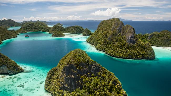 Limestone islands surround a remote, tropical lagoon in Wayag, Raja Ampat, Indonesia. This equatorial region is known for its beautiful reefs and high marine biodiversity.credit: istockescape30 may 2021kendall hill misool resort