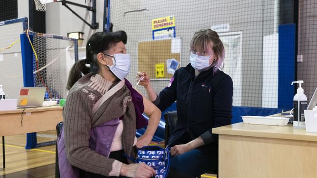 A patient receives the AstraZeneca vaccine at a pop-up walk-in COVID-19 clinic at the Parry Park Sports Centre.