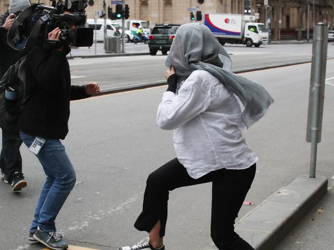 She fled from media outside court, hiding in a shopfront for about 15 minutes. Picture: NewsWire / David Crosling