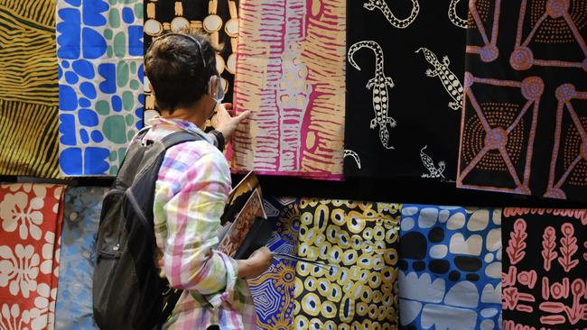 Ikuntji Artists' booth at 2022 Darwin Aboriginal Arts Fair. Picture: Michael Jalaru Torres