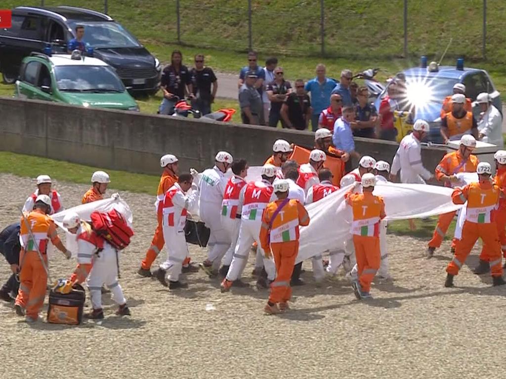 Michele Pirro is carried off the track after his crash.