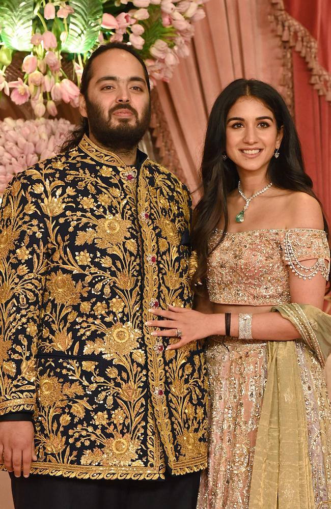 The childhood sweethearts pose for a picture during their sangeet ceremony in Mumbai on July 5. Picture: Sujit Jaiswal/AFP