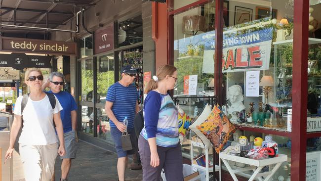 Shoppers perusing the sale items at Acquisitions in Leura which, says co-owner Robert Noble, is only relocating. It’s not closing due to fires, he said, adding “We need people back here because we’re a tourist town”. Picture: Isabell Petrinic