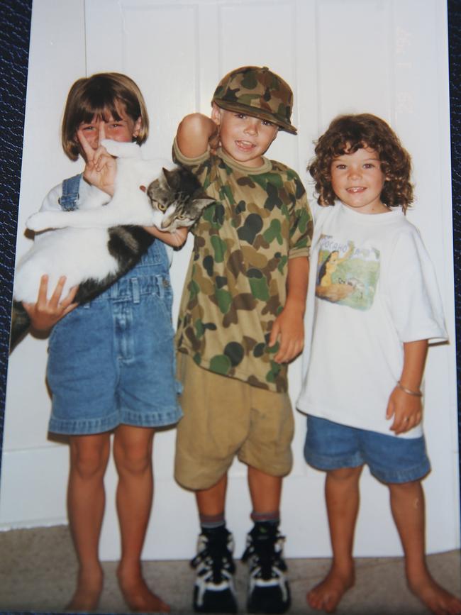 Jack as a child with his sisters and wearing a military shirt which he always had on. Britta Campion / The Australian