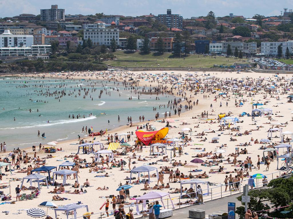 Thousands flocked to the beach after a record hot day on Saturday. Picture: Julian Andrews