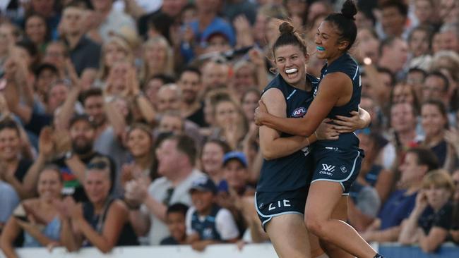 AFLW - Pies vs Blues Carlton player Darcy Vescio kicks a goal in the second term &amp; celebrates with Bella Ayre PictureWayne Ludbey