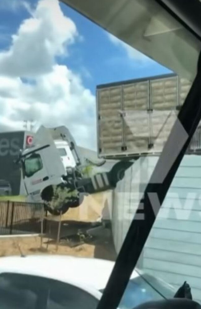 Truck over a wall at the Big Fish Bunnings and Coles complex on Pumicestone Rd. Picture: 7News