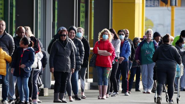 People queue outside a supermarket in Auckland on Wednesday. Picture: Getty Images