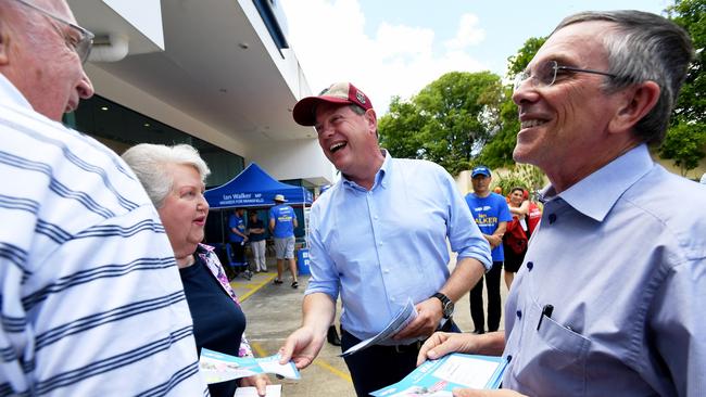 Queensland Opposition leader Tim Nicholls (centre) with LNP MP Ian Walker (right), handing out how-to-vote cards in Upper Mt Gravatt this morning. Picture: AAP/Tracey Nearmy