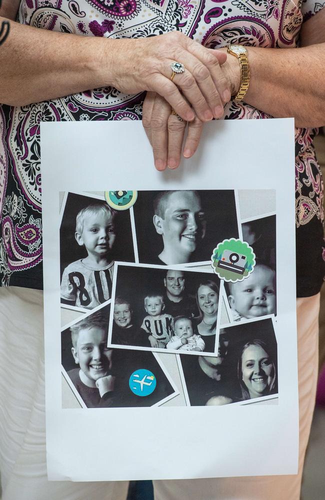 Paul Kilmister’s mother, Christine, holds a photo collage of Paul with his sons, Felix, 14, Harrison, 12, Morgan, 2 and Austin, 8 months. Picture: Jason Edwards