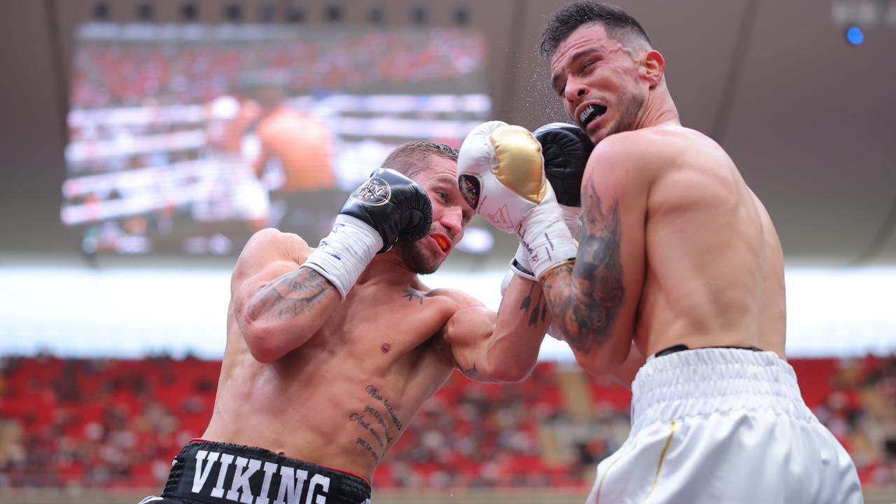 Steve Spark punches Gabriel Gollaz of Mexico during the fight for the WBA Inter-Continental Super Light title at Akron Stadium. Picture: Hector Vivas/Getty Images.