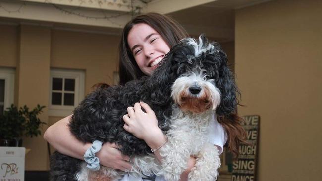 Chelsea Ireland with her dog Buddy. Picture: Supplied by family