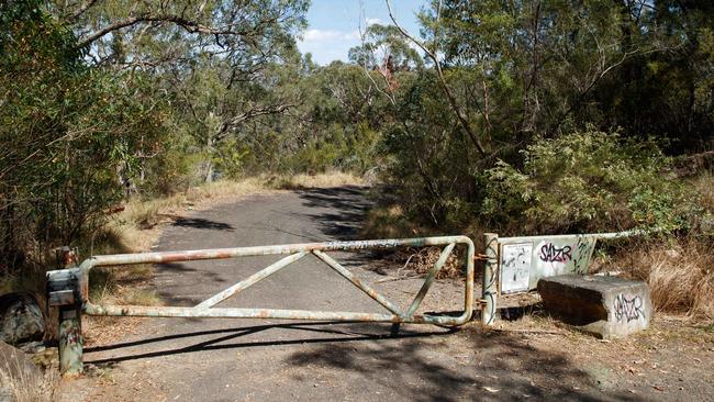 A locked gate on Wilton Park Rd leading to Maldon Suspension Bridge on the Nepean River, near where the body of a 15-year-old boy was discovered with stab wounds. Picture: Max Mason-Hubers/NewsWire