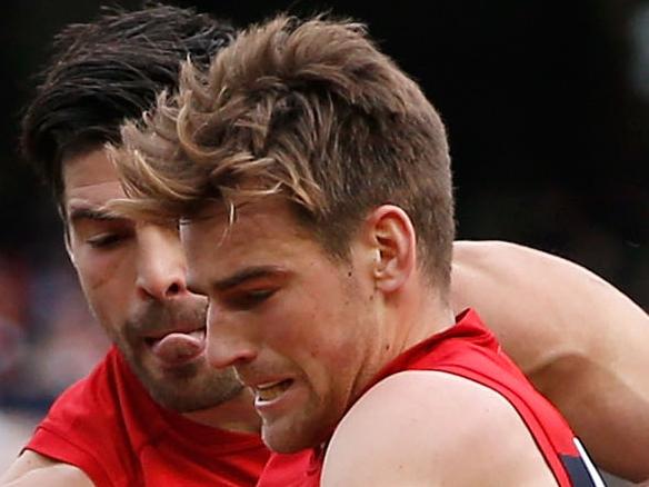 MELBOURNE, VICTORIA - JULY 26: David Armitage of the Saints tackles Dom Tyson of the Demons during the round 17 AFL match between the Melbourne Demons and the St Kilda Saints at Melbourne Cricket Ground on July 26, 2015 in Melbourne, Australia. (Photo by Darrian Traynor/AFL Media/Getty Images)