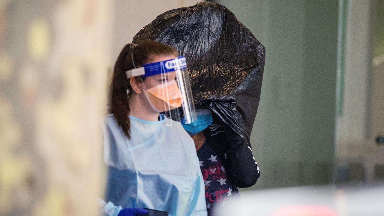 People leave hotel quarantine in Melbourne. Picture: Darrian Traynor/Getty Images