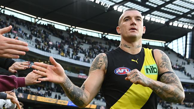 MELBOURNE, AUSTRALIA - MAY 07: Dustin Martin of the Tigers high fives fans after winning the round eight AFL match between the Richmond Tigers and the Collingwood Magpies at Melbourne Cricket Ground on May 07, 2022 in Melbourne, Australia. (Photo by Quinn Rooney/Getty Images)